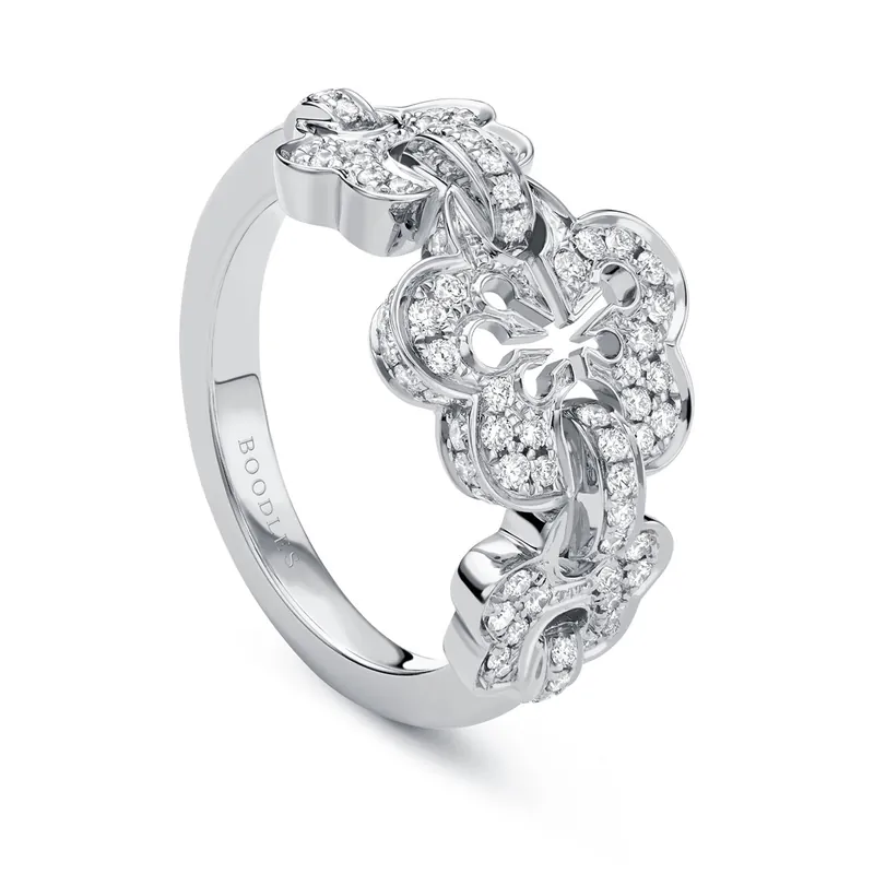 Blossom Triple ring in white gold: three linked blossoms with diamond-set petals across the top of the band