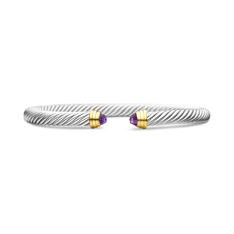 Classic Cable bracelet in sterling silver, 5 mm, its twisted cuff ending in 14k yellow gold caps set with amethyst, on a white ground.