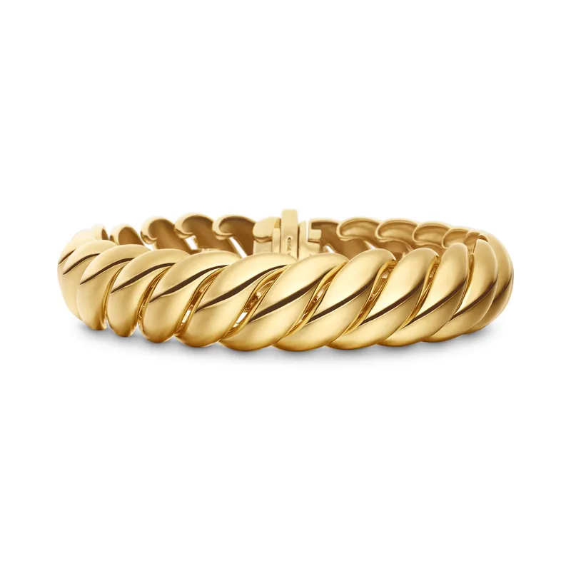 Sculpted Cable bracelet in 18k yellow gold, 14 mm: the cable twist rendered as a row of polished gold waves, on a white ground.