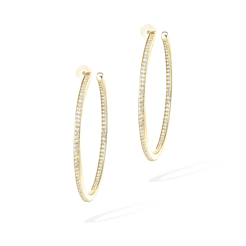 Pair of Gatsby medium hoop earrings in yellow gold, each a thin oval lined with pavé diamonds, on a pale grey ground.