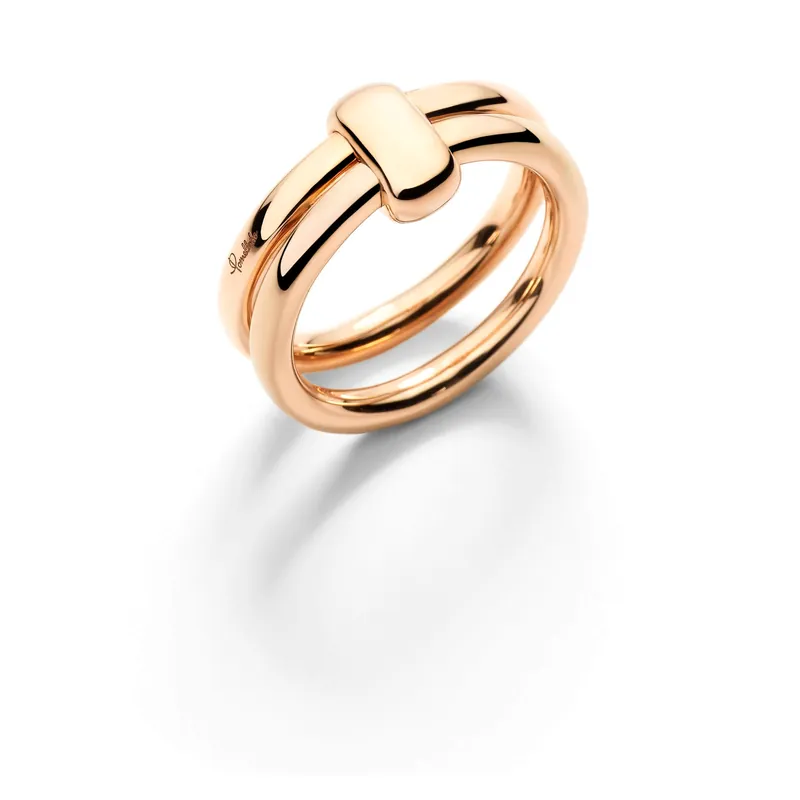 Pomellato Together ring: two thin rose-gold bands held together by one wrapped gold link, on a pale grey ground.
