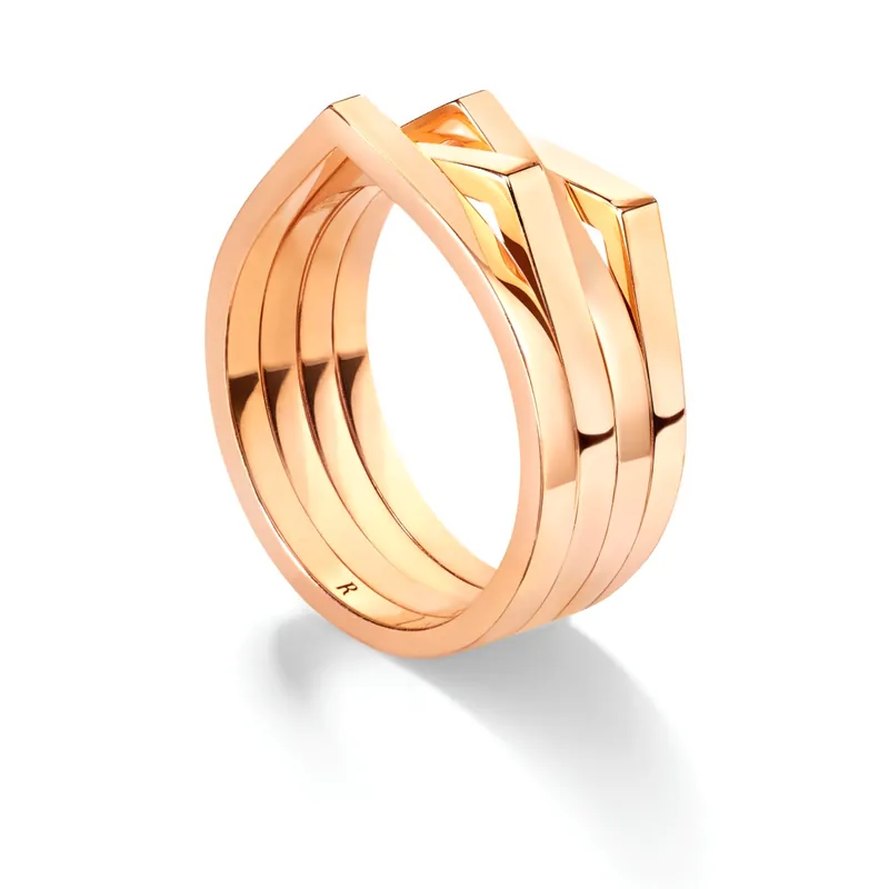 Antifer four-row ring in pink gold, each row rising to a point, on a light grey ground.
